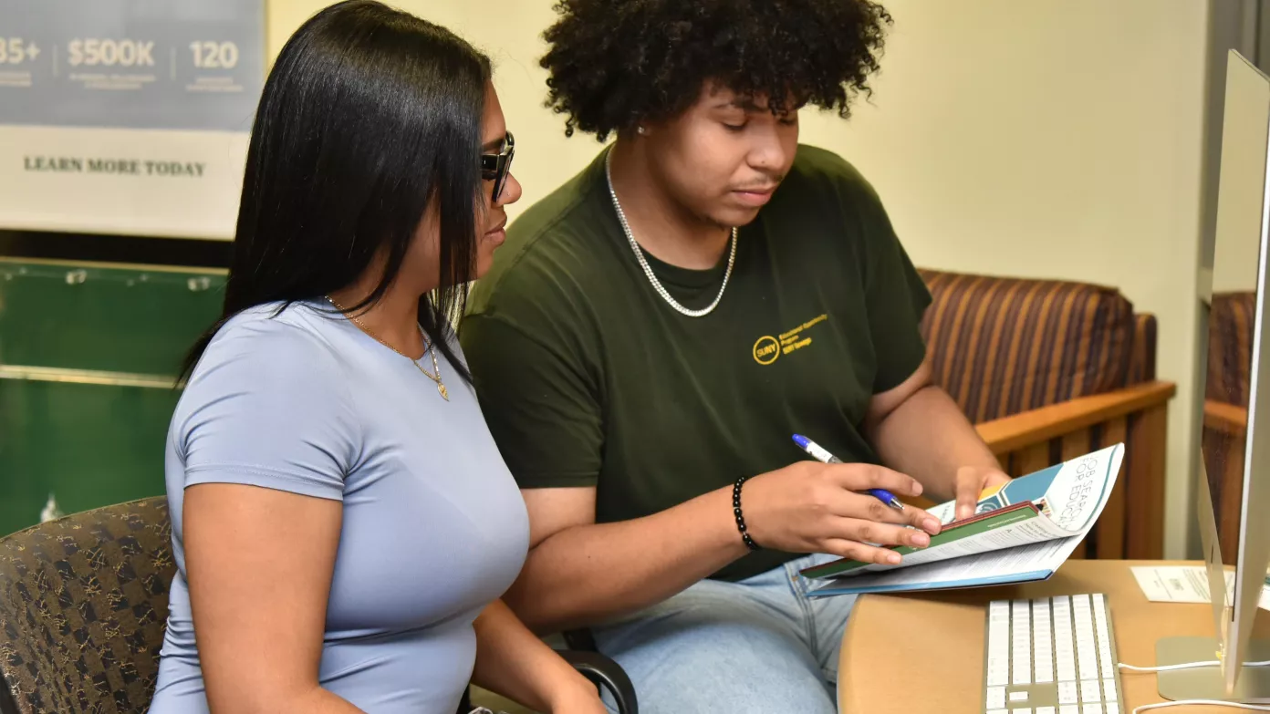 Rosely Paulino and Jeudin Alvarez are among the peer mentors in SUNY Oswego's new Money Matters financial literacy program.