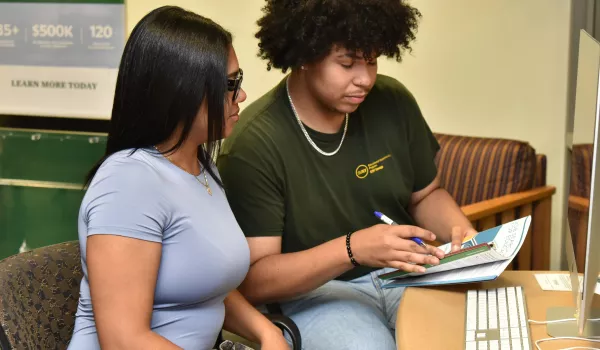 Rosely Paulino and Jeudin Alvarez are among the peer mentors in SUNY Oswego's new Money Matters financial literacy program.