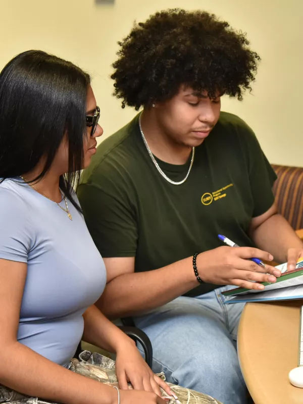 Rosely Paulino and Jeudin Alvarez are among the peer mentors in SUNY Oswego's new Money Matters financial literacy program.